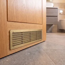 Oboustranná ventilační mřížka do dveří 430 x 115 mm / Zlatá patina